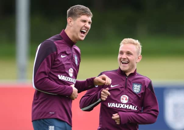 Englands Under-21 stars John Stones, left, and Alex Pritchard  during a training session at St Georges Park, Burton (Picture: Joe Giddens/PA).