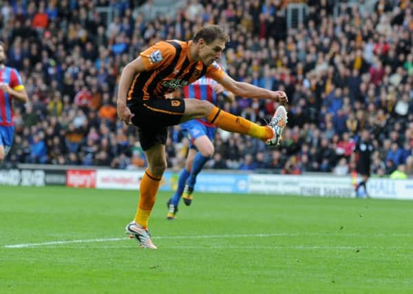 Nikica Jelavic strikes for the Tigers.