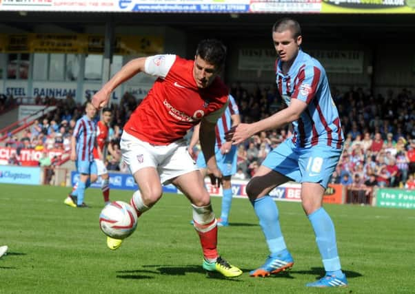 3 May 2014.......      Scunthorpe United v York City Skybet League 2
York forward Michael Coulson sheilds the ball from Iron's Eddie Nolan. Picture by Tony Johnson