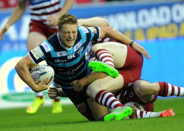 Leeds' Jimmy Kienhorst winces as he is tackled.