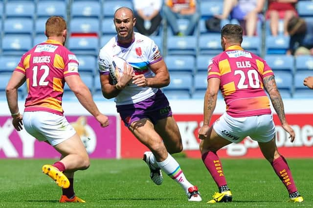 Hull Kingston Rovers' Dane Tilse looks to go betwewn Huddersfield Giants' Jack Hughes and Jamie Ellis. (Picture: John Rushworth)