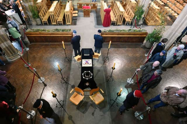 Crowds viewing the coffin holding the remains of Richard III inside Leicester Cathedral