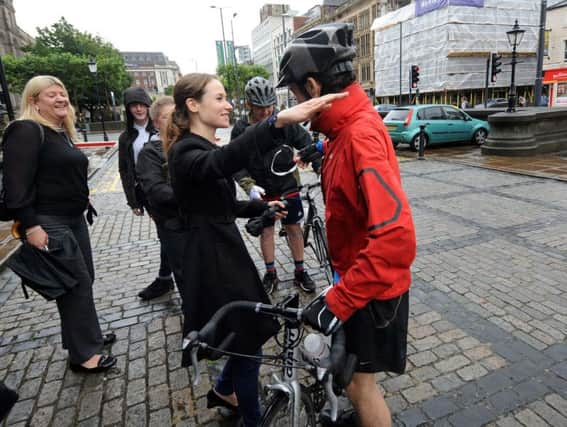 James Weaver is congratulated by Emma Maguire, the daughter of Ann Maguire. Photo by Simon Hulme.