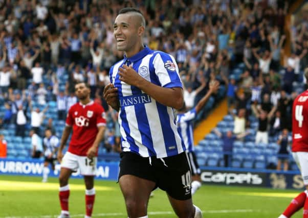 Owls winger Lewis McGugan celebrates his goal and his team's second against Bristol City.