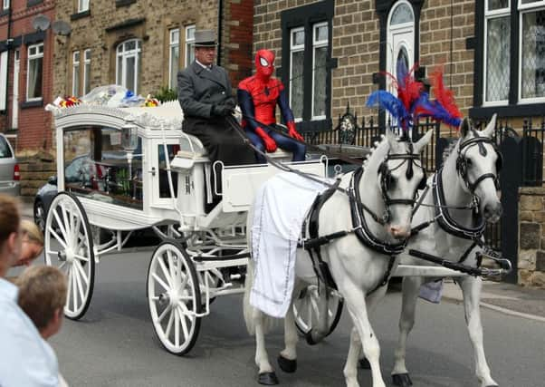 The coffin of seven year old Conley Thompson arriving at St Thomas and St James Church in Worsbrough Dale