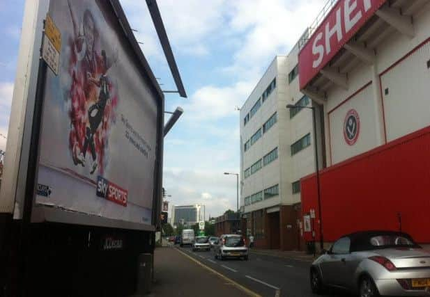 The Carlos Tevez poster outside Bramall Lane yesterday.