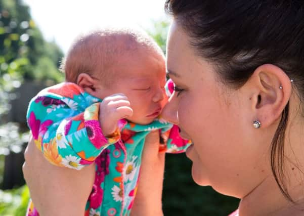 Amy Cade, with baby Nellie, born at Halifax Agricultural Show