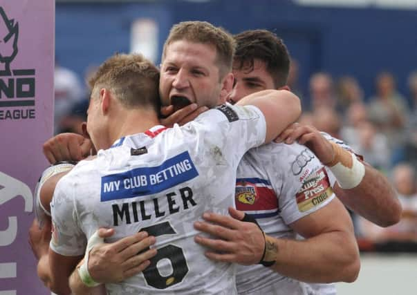 Nick Scruton celebrates a  try.