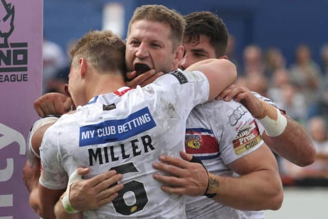 Nick Scruton celebrates a  try.