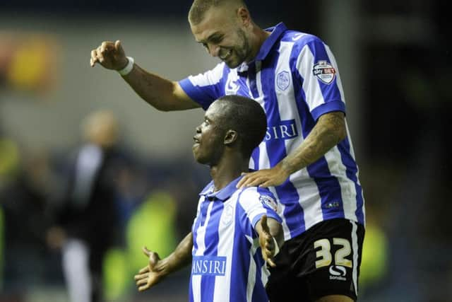 Modou Sougou celebrates with Jack Hunt after his Owls equaliser.