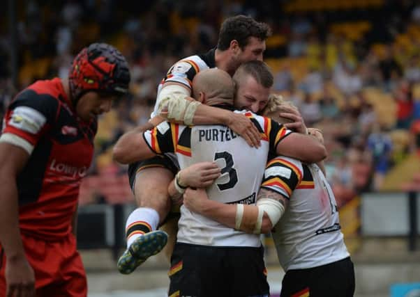 Bradford Bulls' Danny Addy celebrates with team-mates.