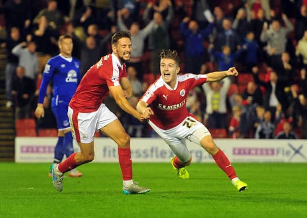 Barnsley's Dan Crowley celebrates scoring his side's third goal with Conor Hourihane. Picture: Tony Johnson