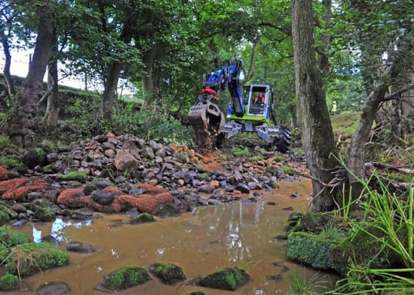 Contractors use a 'spider' for restoration works  to the River Washburn by Swinsty reservoir, aimed at improving the water flow to help wildlife. Picture by Tony Johnson