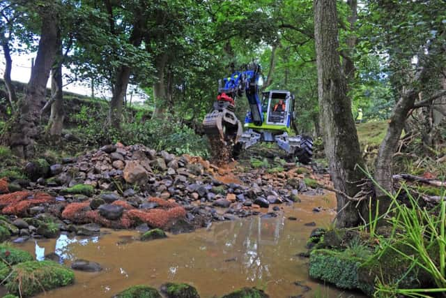 Contractors use a 'spider' for restoration works  to the River Washburn by Swinsty reservoir, aimed at improving the water flow to help wildlife. Picture by Tony Johnson