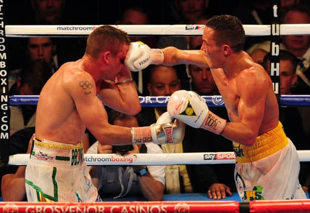 WINNER: Josh Warrington, right, takes on Joel Brunker. Picture: Tony Johnson