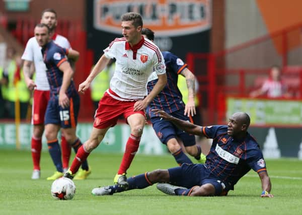 Sheffield Uniteds Chris Basham is enjoying his central midfield role for the Blades (Picture: Martyn Harrison).