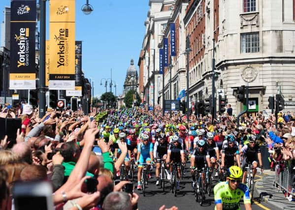 Mark Cavendish and Chris Froome (front) lead the Grand Depart at the ceremonial start of The Tour De France 2014.