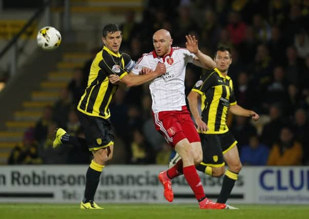 Conor Sammon of Sheffield United competes with Burton's Joe Mousinho.