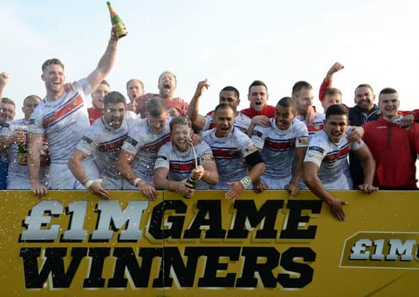 Wakefield Trinity Wildcats celebrate their victory in the Million Pound Game, Play-Off Final match at Belle Vue, Wakefield. PRESS ASSOCIATION Photo. Picture date: Saturday October 3, 2015. See PA story RUGBYL Wakefield. Photo credit should read: Anna Gowthorpe/PA Wire. RESTRICTIONS: Editorial use only. No commercial use. No false commercial association. No video emulation. No manipulation of images.