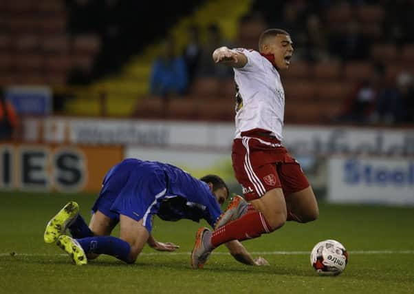 Che Adams of Sheffield Utd is brought down by Haydn Hollis to concede another penalty and earn Hollis a red card 
Sport Image.