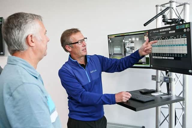 Iain Mackenzie runs through some swing data with Chris Stratford at the iGolfStudio in Sheffield (Picture: drivinggolf.co.uk).