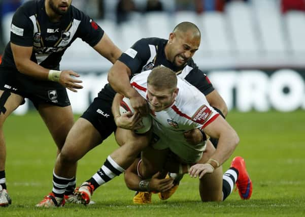 England's Tom Burgess and New Zealand's Sam Moa.