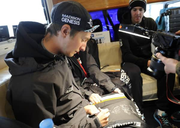 Liam Holohan, in his Madison Genesis days, signs a team jersey ahead of the final stage of the Tour de Yorkshire in 2015. (Picture: Bruce Rollinson)