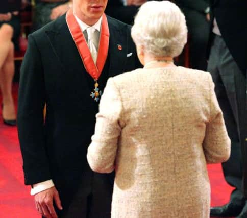 Actor Benedict Cumberbatch receives the CBE  at Buckingham Palace.