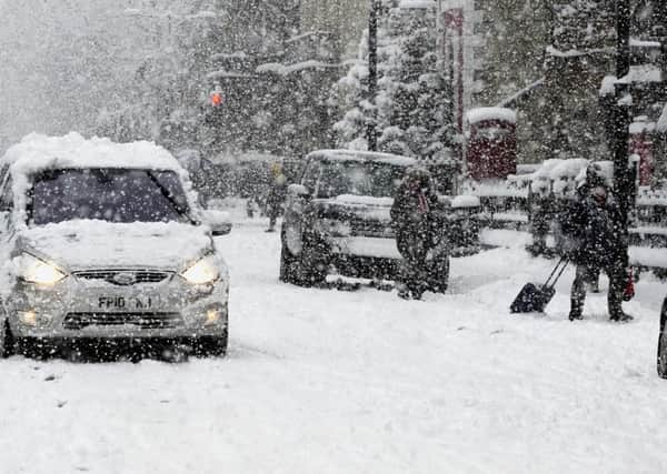 Drivers and pedestrians make their way through the centre of York, as the big freze took hold on Wednesday December 1, 2010.
Photo: John Giles/PA Wire