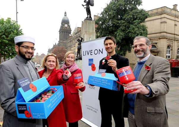 Leeds imam Qari Asim, left, with other faith leaders at the launch of the Poppy Appeal.