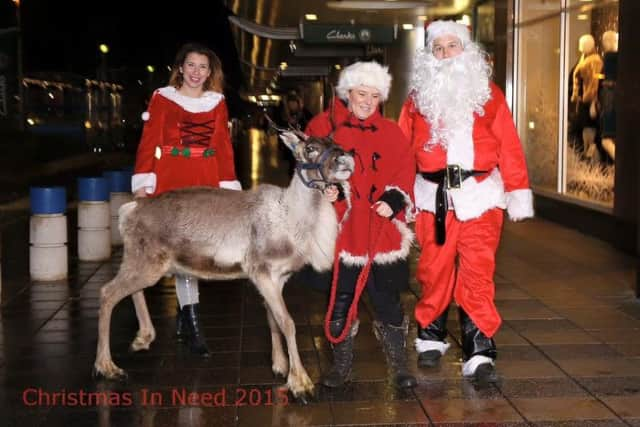 The Christmas in Needs team deliver their presents.