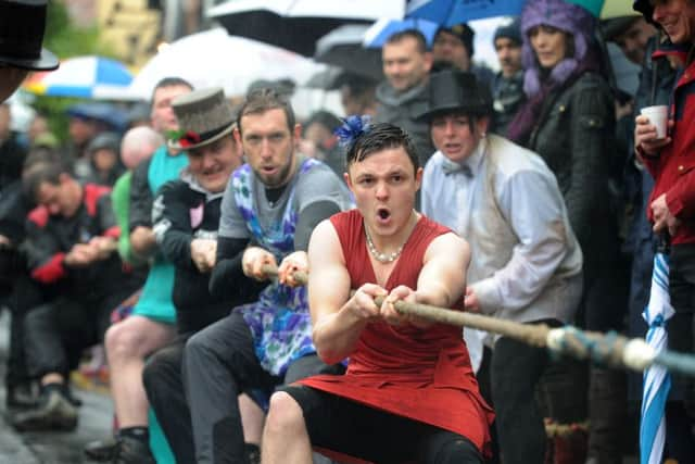 The mens' Half Moon team pull against the Mother Shipton's Inn in the annual Boxing Day Knaresborough tug of war.   Picture Tony Johnson