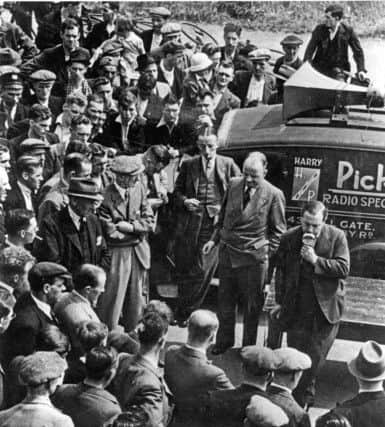 Priestley talks to miners in the pit yard