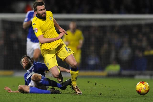 Stuart Dallas falls from a Cole Skuse challenge. (Picture: Bruce Rollinson)