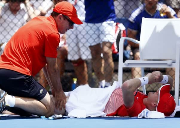 Kyle Edmund receives treatment during his first round defeat against Damir Dzuhmur. Picture: AP /Rafiq Maqbool.