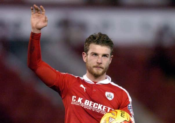 Barnsleys hat-trick hero Sam Winnall clutches the match ball after helping rout Rochdale at Oakwell (Picture: James Hardisty).