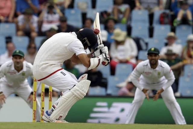 TAKE COVER: Englands batsman Moeen Ali ducks under a delivery on day three of the fourth Test against South Africa.  Picture: Themba Hadebe/AP.