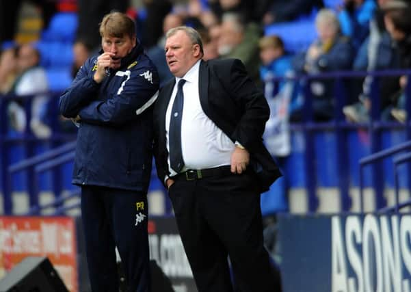 United's head coach Steve Evans, right, with his assistant Paul Raynor.