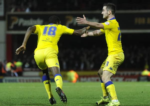 Mustapha Carayol turns to Lewis Cook to celebrate his equaliser.