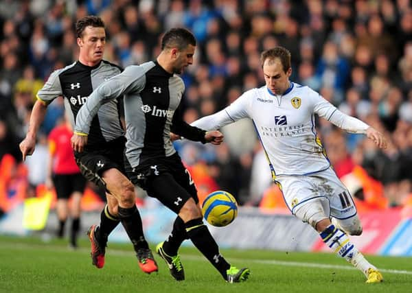 Leeds United's Luke Varney battles for the ball with Tottenham Hotspur's Kyle Walker in the FA Cup fourth round in 2013.