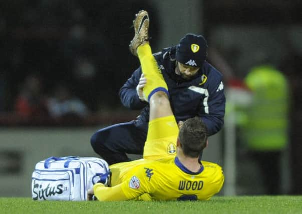 Chris Wood is treated for a hamstring injury.