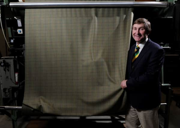 Charles Mills, Show Director of the Great Yorkshire Show watching as

the specially commissioned Yorkshire tweed comes off the loom at Abraham Moon & 

Sons in Guiseley.