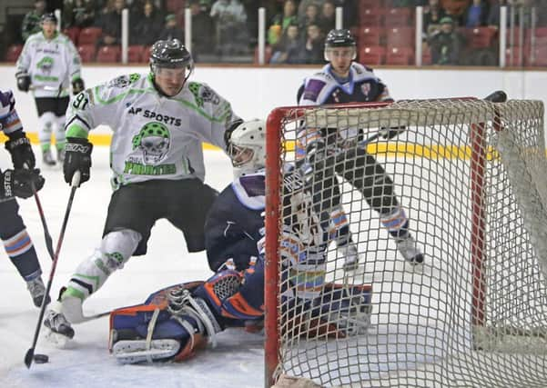 Hull's Nathan Salem, left, in action during the 6-1 home loss to Peterborough