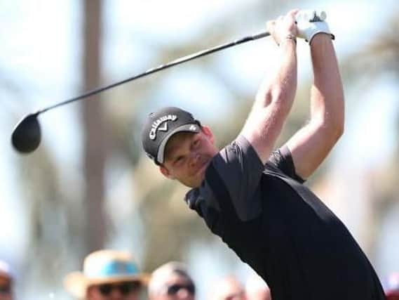 Danny Willett tees off at the first on his way to a third-round 65 in the Dubai Desert Classic (Picture: Kamran Jebreili/AP).