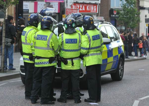 Police at the scene of a far-right rally. A debate on immigration needs to be held - but in a constructive and respectful manner.