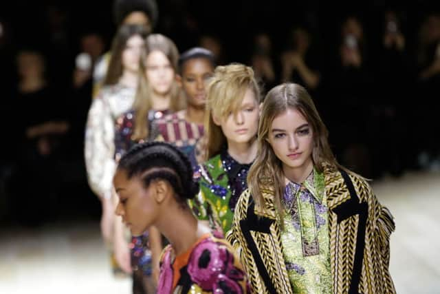 Models on the catwalk during the Burberry Autumn/Winter 2016 London Fashion Week show at West Albert Lawn, Kensington Gardens, London. Daniel Leal-Olivas/PA Wire