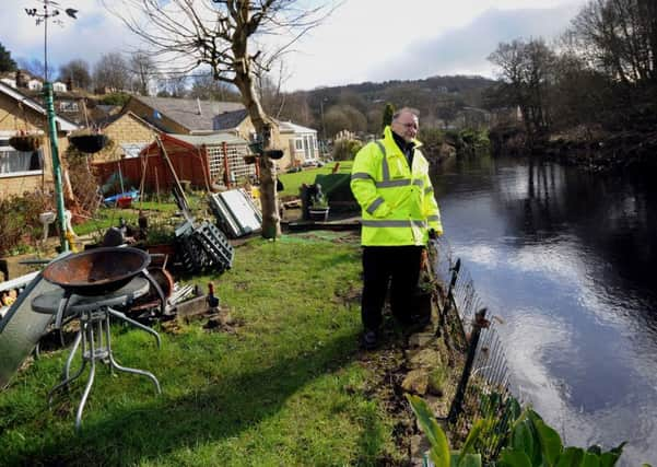 John Armitage outside his home in Luddendenfoot in West Yorkshire.