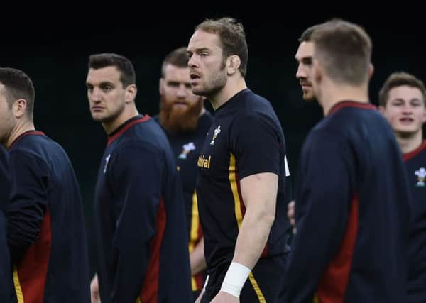 Wales' Gareth Davies, left, Sam Warburton, centre, and Alun Wyn Jones during the Captain's Run at the Principality Stadium yesterday.