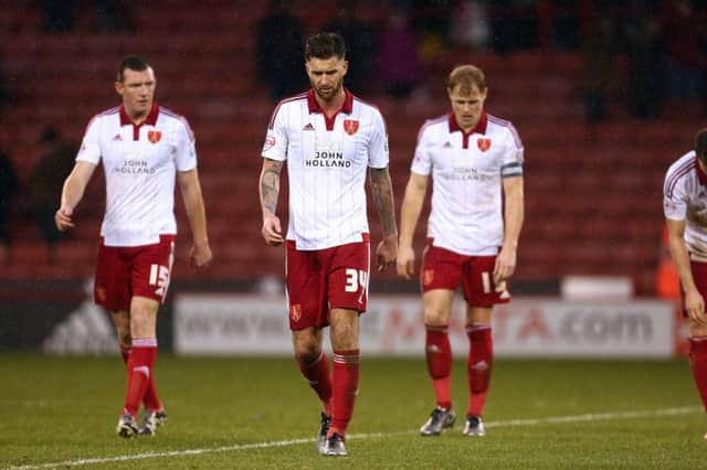 Sheffield Uniteds David Edgar, centre, has urged hs team-mates to build on the positives of taking six points from nine last week, ahead of todays trip to Rochdale.