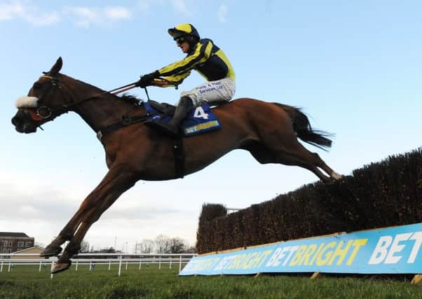 The Last Samuri ridden by David Bass clear the final fence on their way to winning The BetBright Grimthorpe Chase at Doncaster Racecourse. PIC: PA